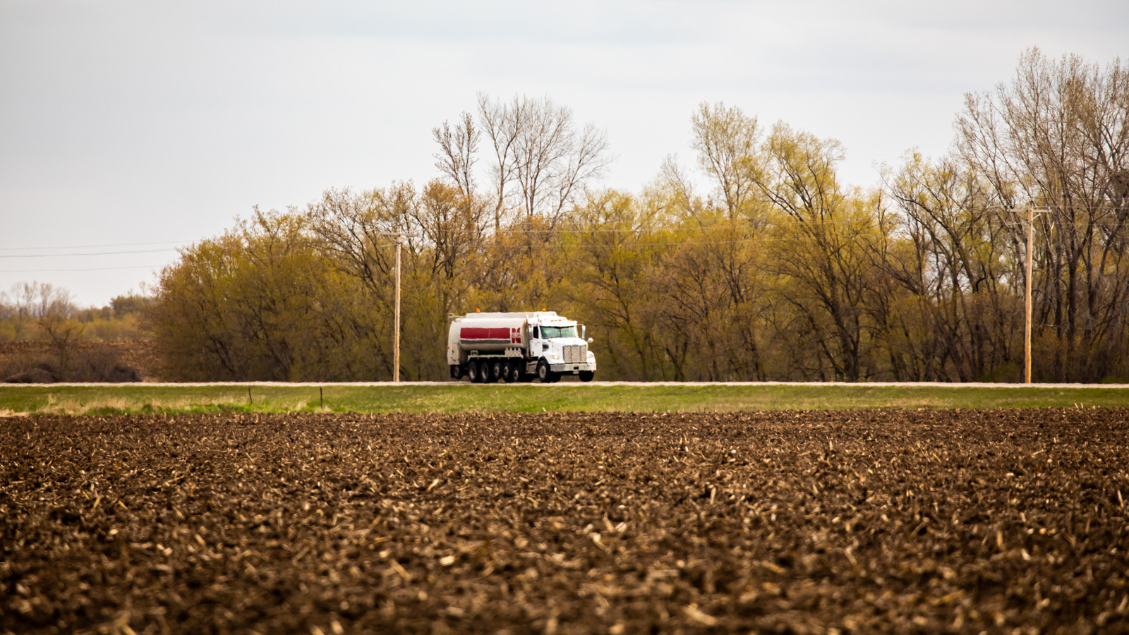 Cenex propane truck driving down a rural road