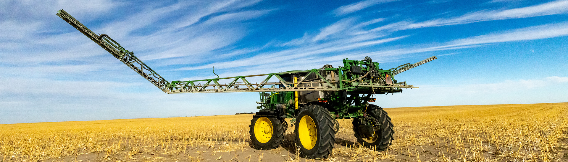 Farm equipment in harvested corn field
